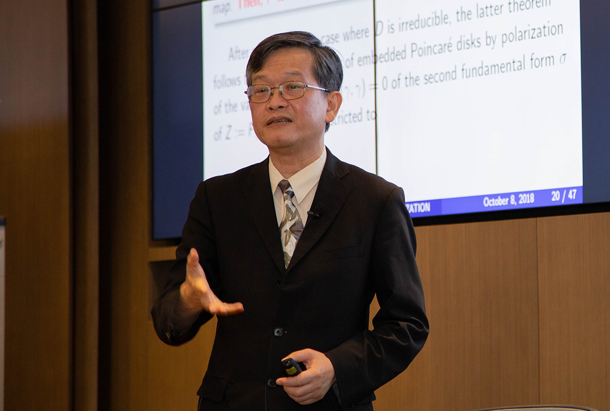 Curvature and Uniformization on Bounded Symmetric Domains